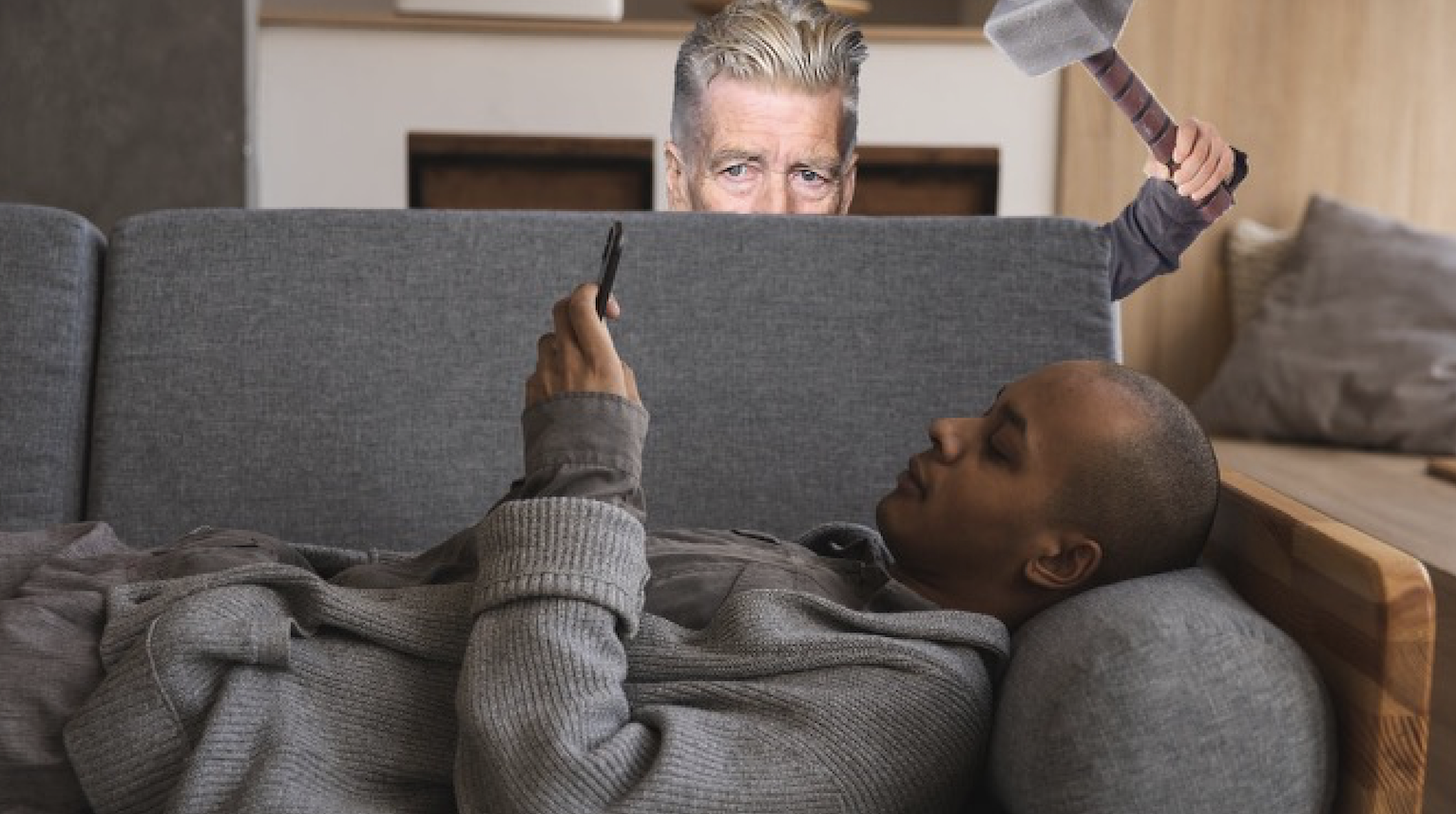 Man Watching Movie On Phone Blissfully Unaware David Lynch About to